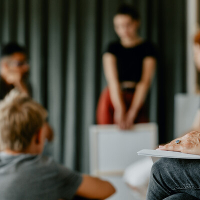 People sitting together in a support group circle