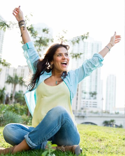 Woman with arms raised up